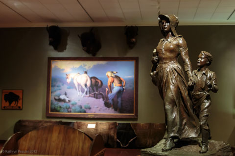A bronze sculpture of a pioneer woman and her son at the Woolaroc Museum