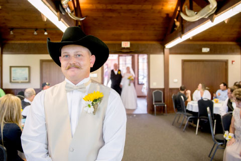 A groom waiting for his bride during a wedding at Woolaroc