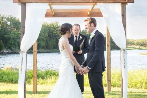 A wedding next to Clyde Lake at Woolaroc