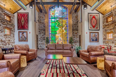 Woolaroc Welcome Center main hall with centered view of stained glass window