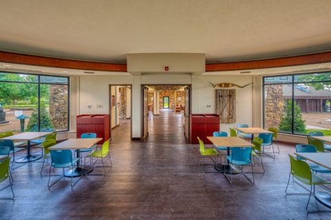 Woolaroc Welcome Center dining area with view looking through entrance to main hall